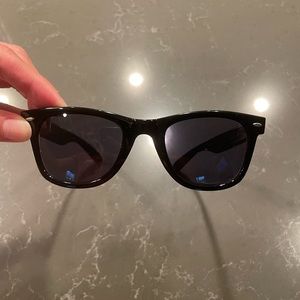 Black sunglasses that look like RayBans